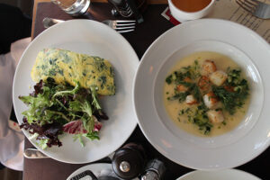 Omelette with spinach and herbs and seared scallops from Cafe Cluny