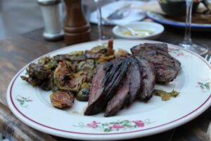 Steak and brussels sprouts at Gemma at the Bowery Hotel