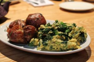 Egg scramble with broccoli rabe and roast potatoes at L'Artusi