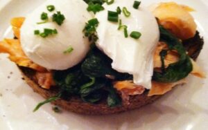 Poached eggs, salmon, spinach nobread at Public
