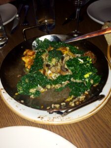 Paella with kale, mushrooms, artichoke, and egg at GATO