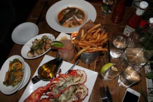 Grilled Lobster, french fries, sea bass at Grey Lady