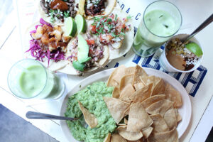 Tacos on corn tortillas and chips and guacamole at Cafe el Presidente