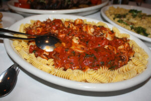 Gluten free pasta with red sauce and calamari at Carmine's