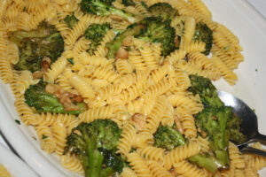 Gluten free pasta with white sauce and broccoli at Carmine's