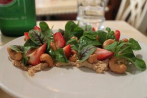 Spinach salad with strawberries and cashew-ricotta at Chalk Point Kitchen