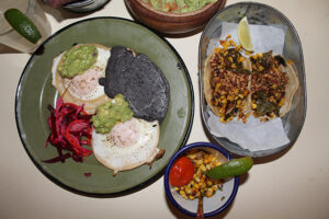 Sunny side up egg tacos, esquites, veggie tacos at Tijuana Picnic