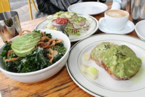 Avocado toast on gluten free toast, tacos verdes, kale salad at The Butcher's Daughter