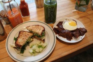 EGG SANDWICH and avocado on GLUTEN FREE BREAD with bacon and egg at The Butcher's Daughter