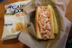 Shrimp roll with gluten free roll and potato chips at Luke's Lobster
