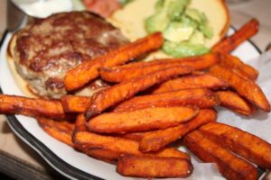 Turkey Burger on a gluten free bun with sweet potato fries at Black Tap