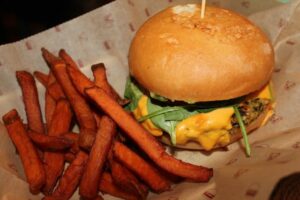 Gluten free veggie burger and bun and sweet potato fries at Bareburger