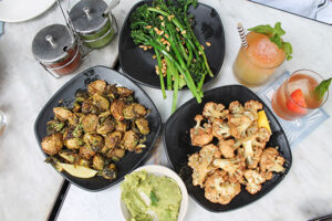 Brussels sprouts with almond pesto, cauliflower with cashew cheese, broccolini from Gracias Madre