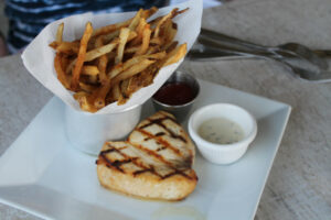 Swordfish with french fries at Louie's Oyster Bar & Grille