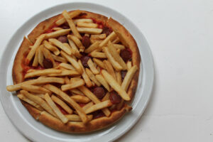 Americano Pizza with french fries and hotdog on gluten free pizza crust at Ribalta Pizza