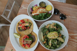 Kale and Avocado salad, seared fish tacos, the reel deel at Seamore's in NoLiTa, New York City