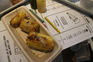 Sweet corn with almond parmesan at by Chloe