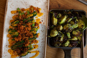 Brussels Sprouts and charred broccoli with spicy carrot from The Little Beet Table