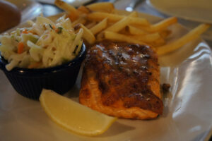 Salmon with coleslaw and french fries at Legal Sea Foods