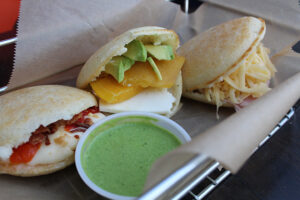 Mango and avocado, roasted red pepper and mozzarella, and ham and cheese arepas at Bolivar Cafe