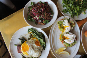 Duck Rillette Salad, Pork belly and eggs, and gluten free avocado toast at LA Chapter