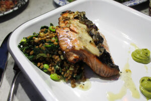 Grilled salmon with sprouted grain on spinach at Mama Shelter