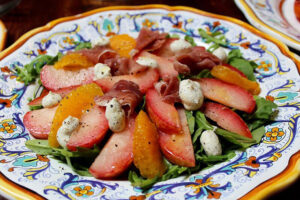 Arugula salad with plums and oranges at Olio E Piu