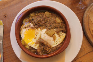 Baked eggs with pulled pork at Coco & Cru