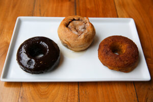Chocolate Doughnut, Apple Cinnamon Roll and Pumpkin Doughnut at Wheat's End Cafe in Chicago, IL