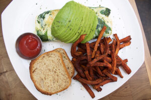 Egg white omelette with spinach and avocado, sweet potato fries, and gluten free bread at Babette's Newport Beach