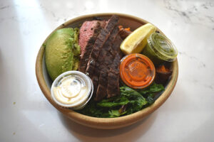 Market Bowl with Field Greens, Steak, Broccoli, Sweet Potato + Avocado at Dig Inn in New York City